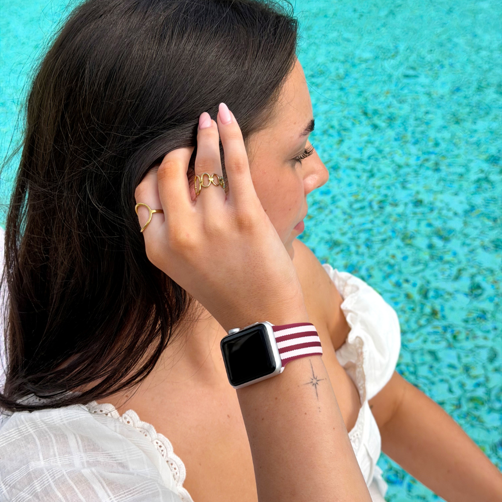 Girl putting hair behind her ear wearing her Blushberry Scallop Stripes Watch Strap