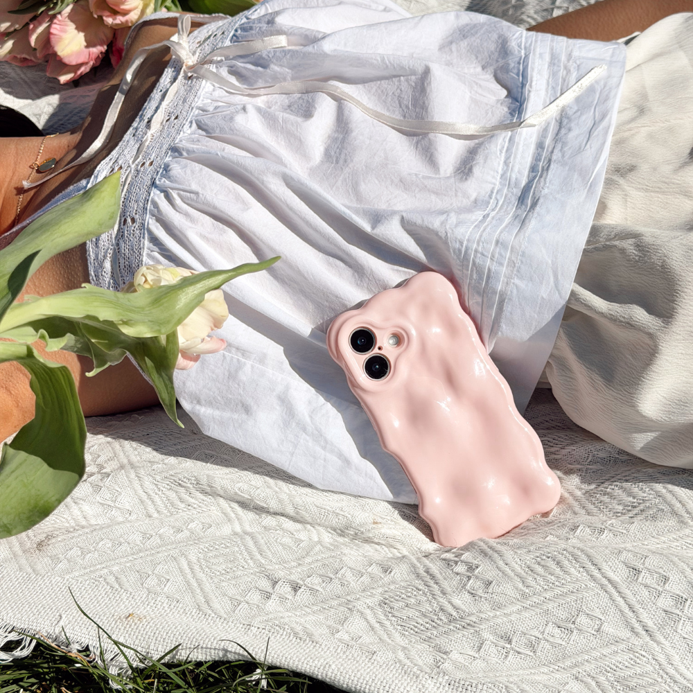 Girl at a picnic with flowers close up image of the 3D Bubble Phone Case in Powder Pink