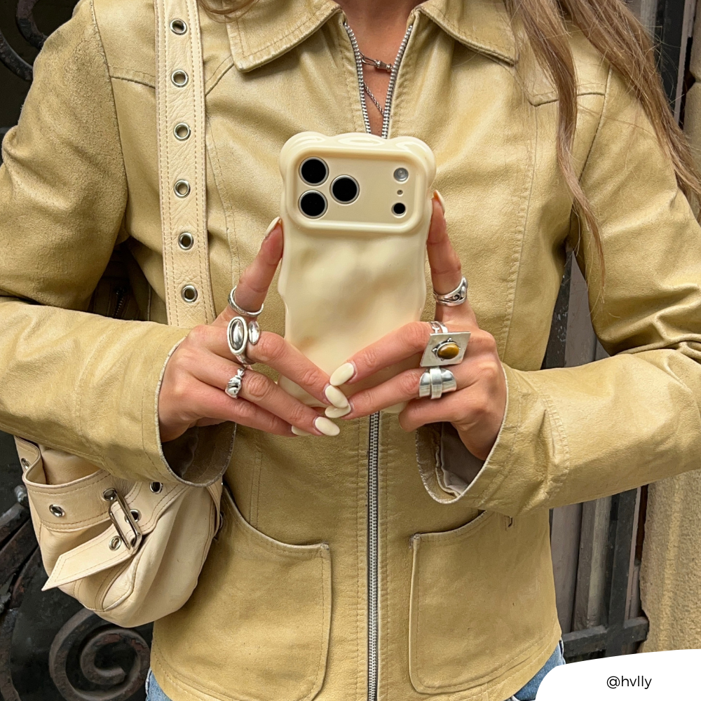 Girl in yellow jacket holding 3D Bubble Phone Case in Butter Yellow