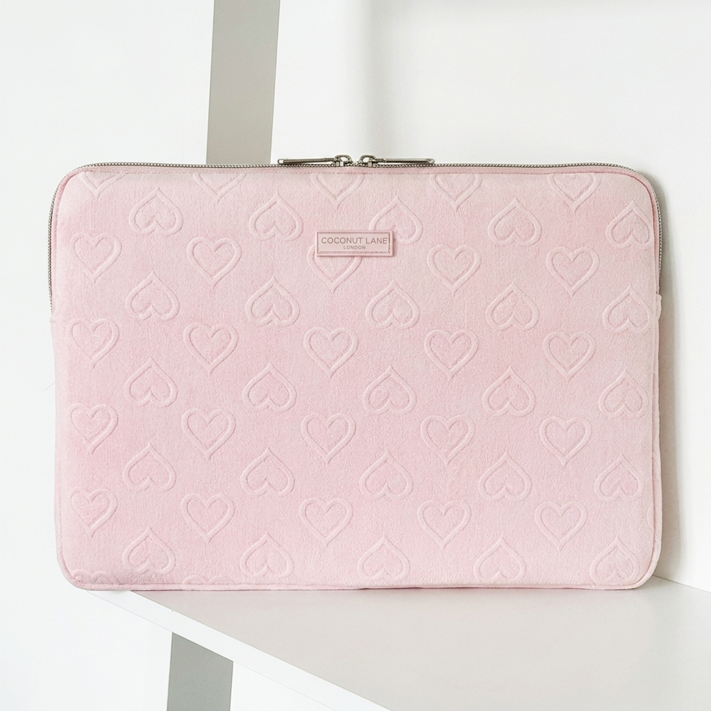 Pink heart design Laptop Sleeve with zip closure and Coconut Lane logo. 