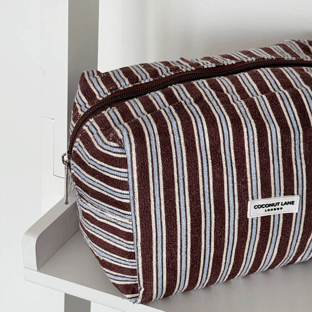 Brown towel texture Makeup Bag with blue and white stripe design. 