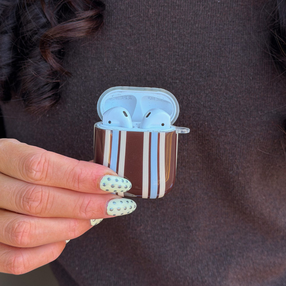 Close up of brown and blue stripe airpods case