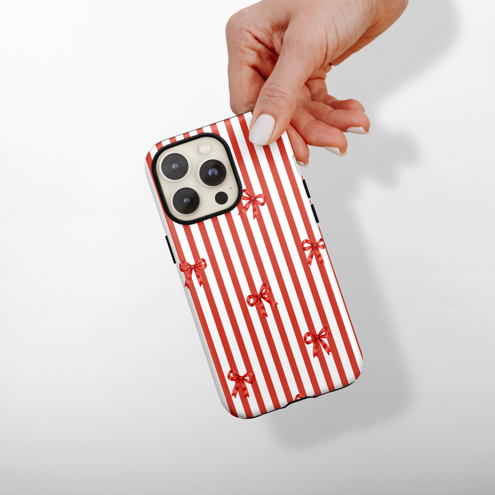 Red and white candy cane stripes with red bows.