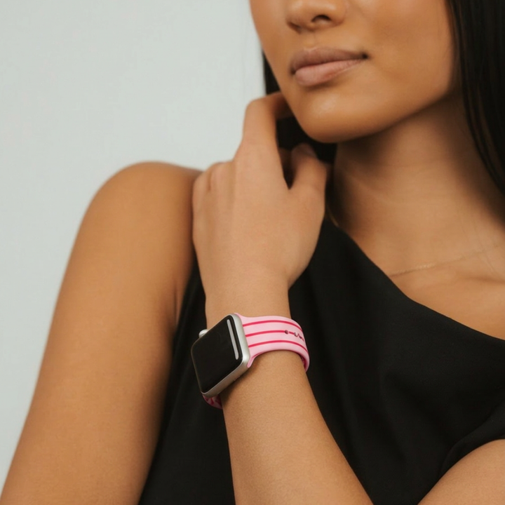 Girl in a studio wearing cherry watch strap on her wrist wearing black tshirt