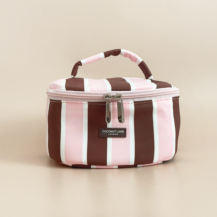 Coconut Lane Cocoa & Pink Stripe round vanity makeup bag with chocolate brown and baby pink stripes, matching handle and double zip closure.