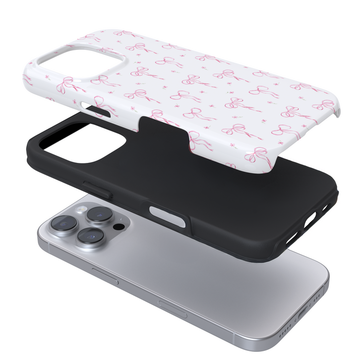 Expanded view of a phone case with a pink bow pattern on white background
