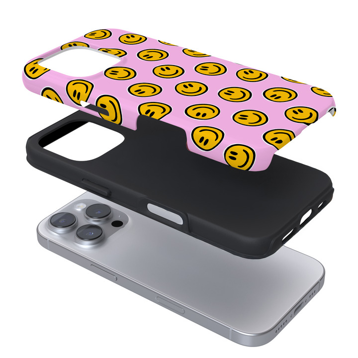 Expanded view of a pink phone case with yellow smiley faces with a white background
