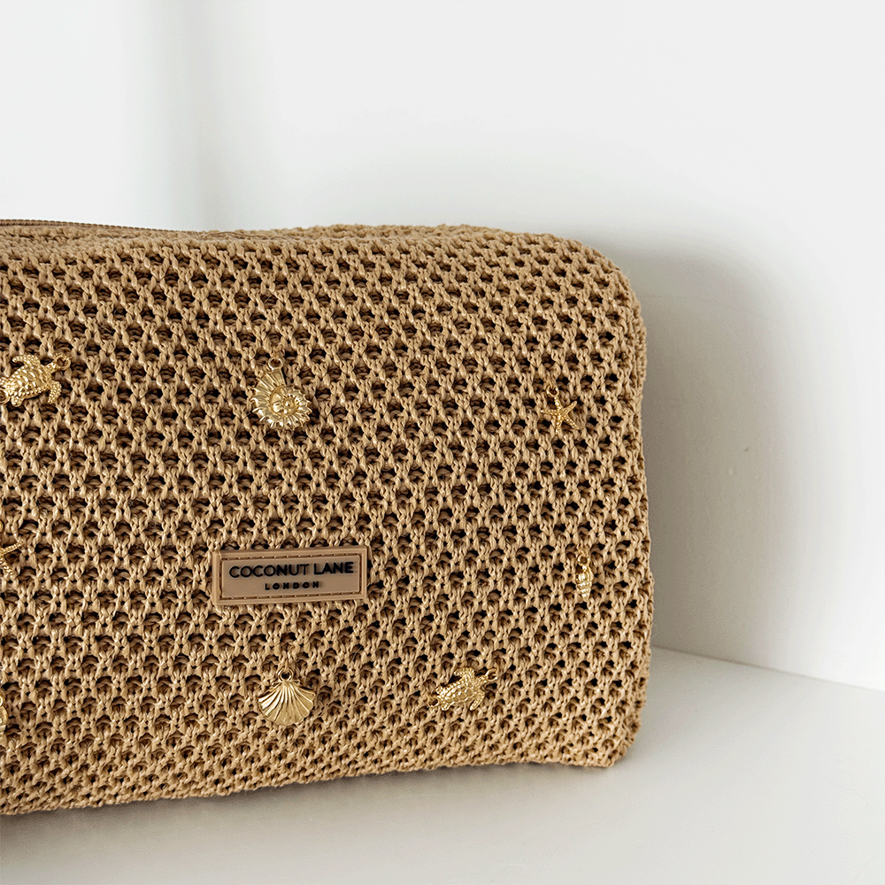 Woven makeup bag with a gold details