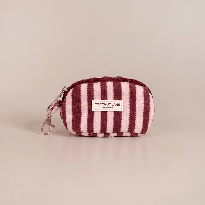 Burgundy and pale pink stripe small keyring bag with zip closure and keychain attachment.