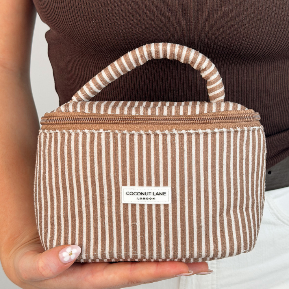close up of mini travel towel vanity chestnut stripes