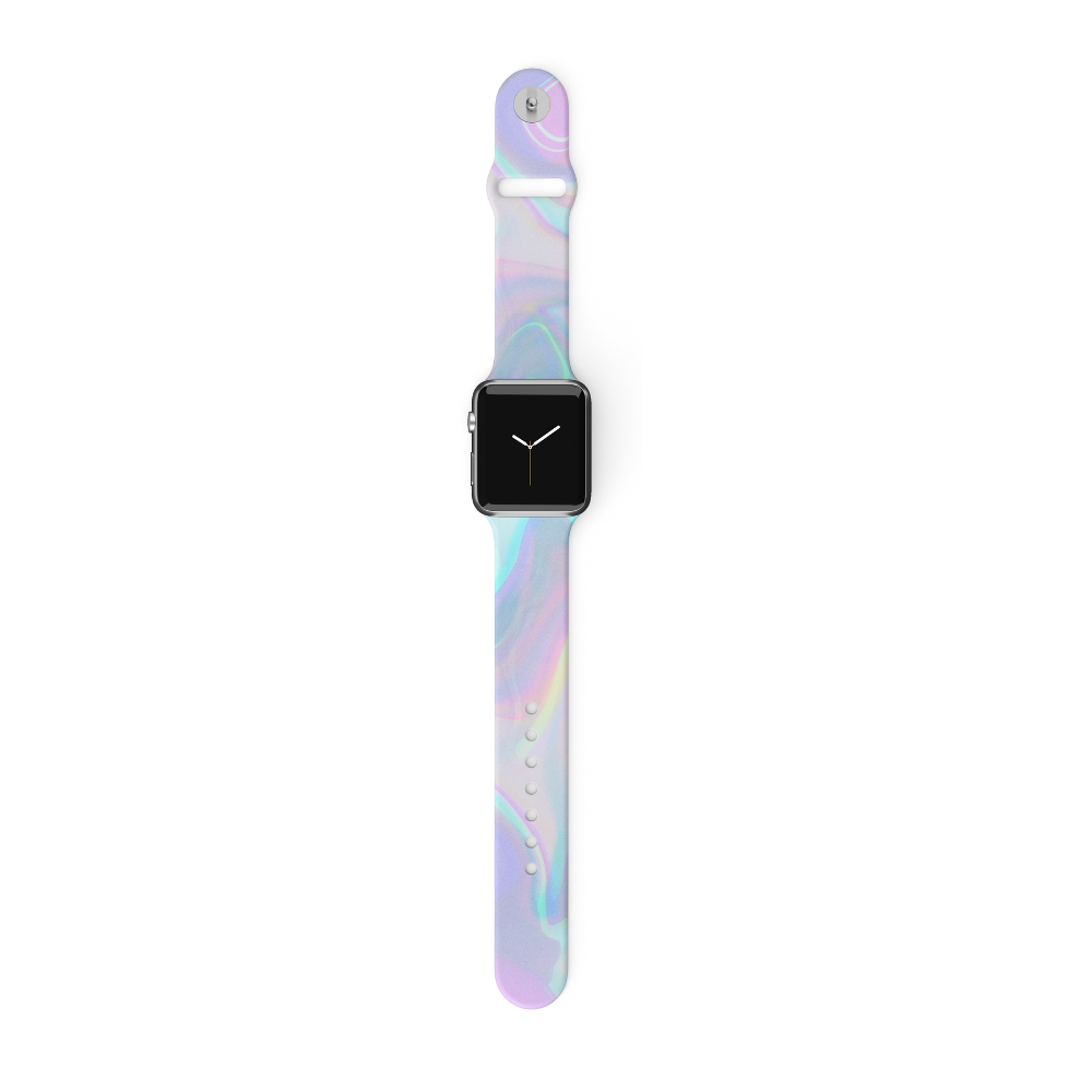 A smartwatch with a black screen displaying white clock hands is attached to the Coconut Lane Holo Bubble Apple Watch Strap, featuring vibrant shades of pink, purple, blue, and green. This holographic iridescent strap has a single loop closure with multiple adjustment holes and a metal clasp at the top.