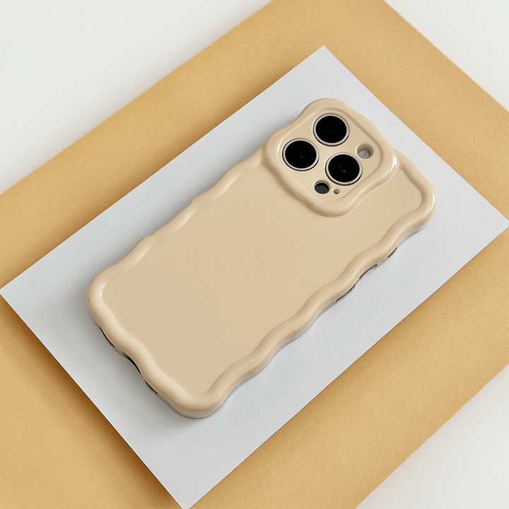 Plain yellow peach coloured Phone Case with wavy edge effect.