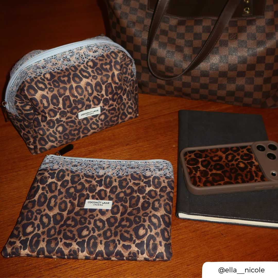 flat lay photo of the lace and leopard makeup bag, everything pouch and mocha leopard phone case. 