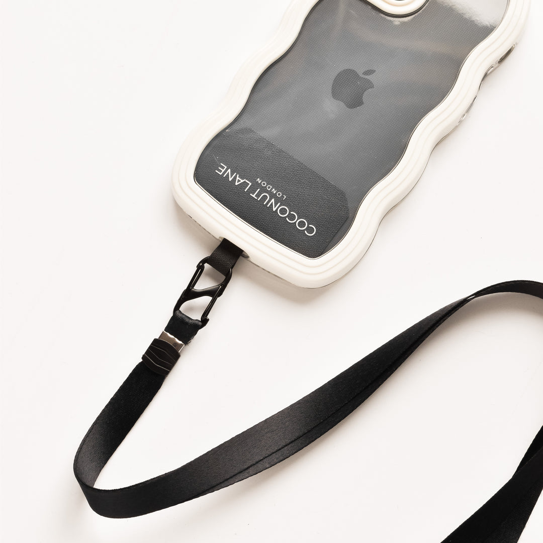A translucent and white phone case featuring a wavy border displays an Apple logo along with the words "COCONUT LANE" in white text. This Universal Phone Patch by Coconut Lane includes an attached black strap with a clip, perfect for securely carrying your phone. It is shown on a white surface.